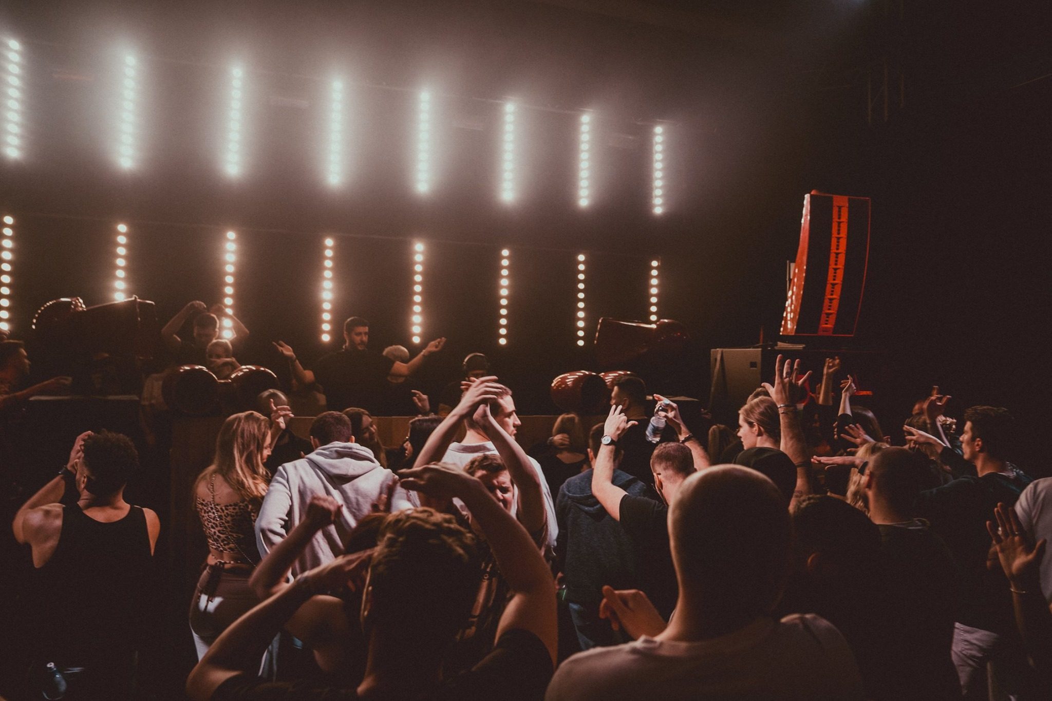 Dancefloor under a wall of light bars
