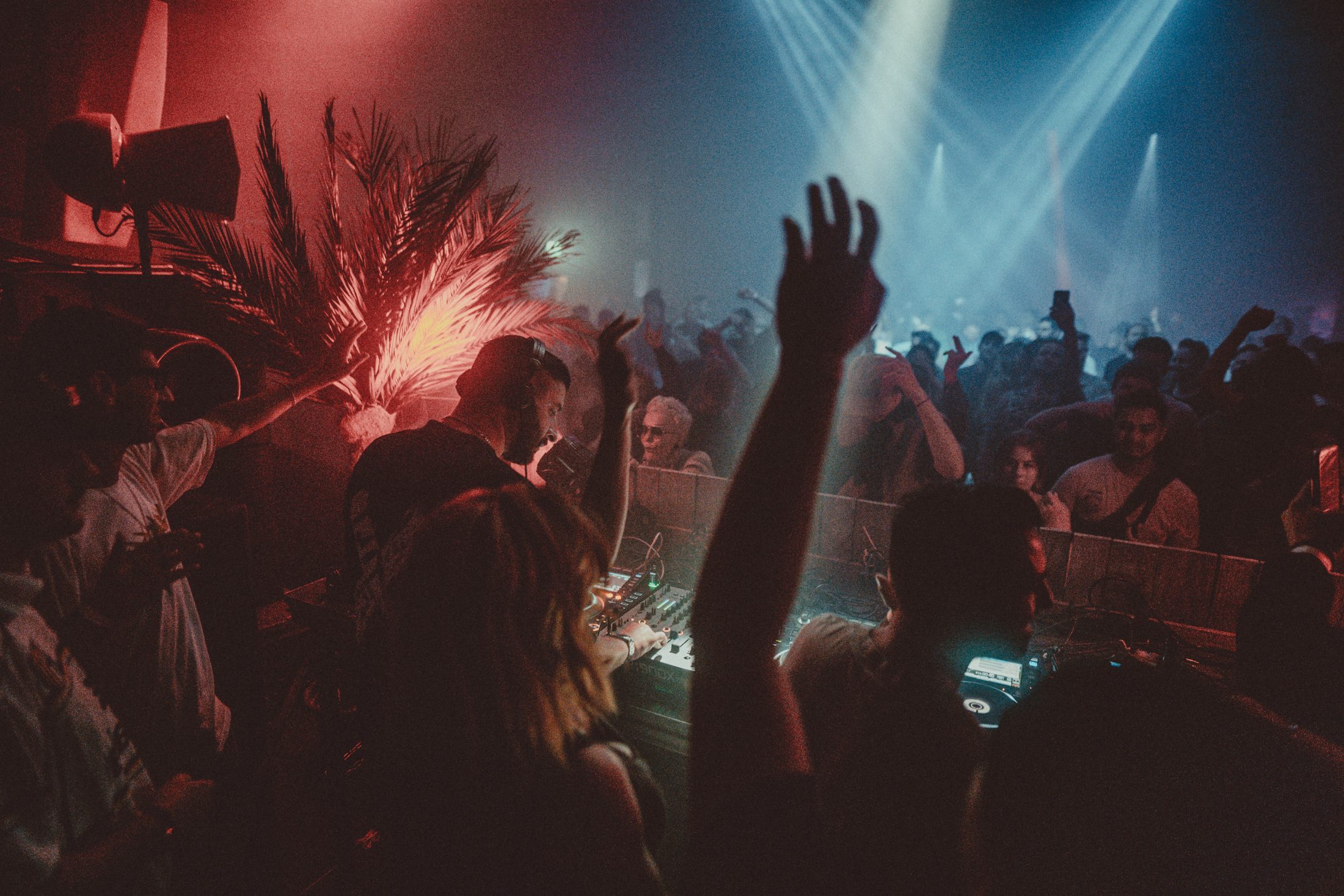 Martin OCCO behind the decks, hands up in the crowd